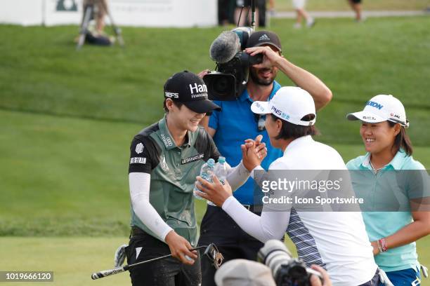 Golfer Sung Hyun Park is congratulated by Amy Yang after winning on the 18th hole in a sudden death playoff during the final round of the Indy Women...