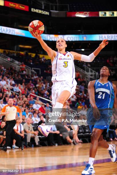 Diana Taurasi of the Phoenix Mercury shoots against Nicky Anosike of the Minnesota Lynx in an WNBA game played on June 10, 2010 at U.S. Airways...
