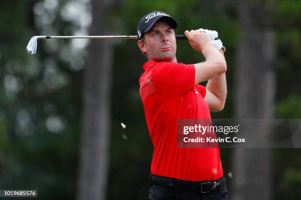 Webb Simpson plays his shot from the 16th tee during the final round of the Wyndham Championship at Sedgefield Country Club on August 19, 2018 in...