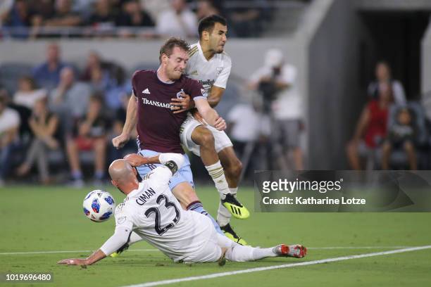 Laurent Ciman of Los Angeles FC, Jack McBean of Colorado Rapids and Steven Beitashour of Los Angeles FC fight for control of the ball after McBean's...