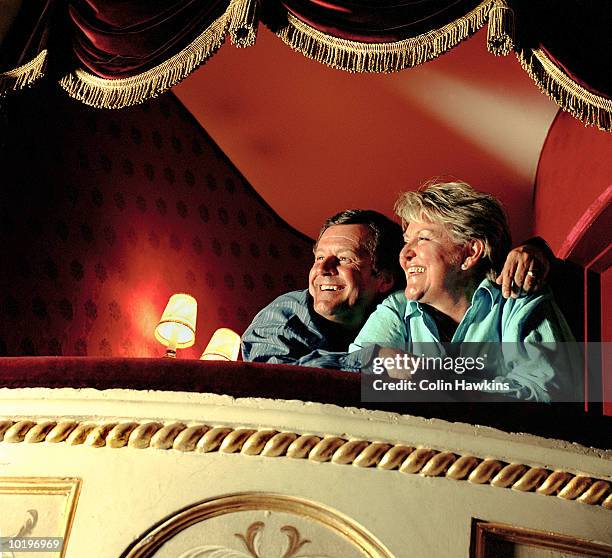 mature couple in theatre box, laughing - camarote - fotografias e filmes do acervo