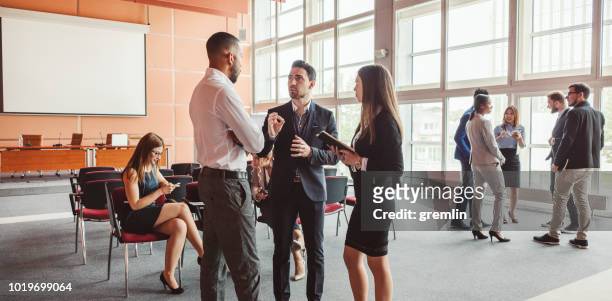 group of business people in the conference room - cliqueimages stock pictures, royalty-free photos & images