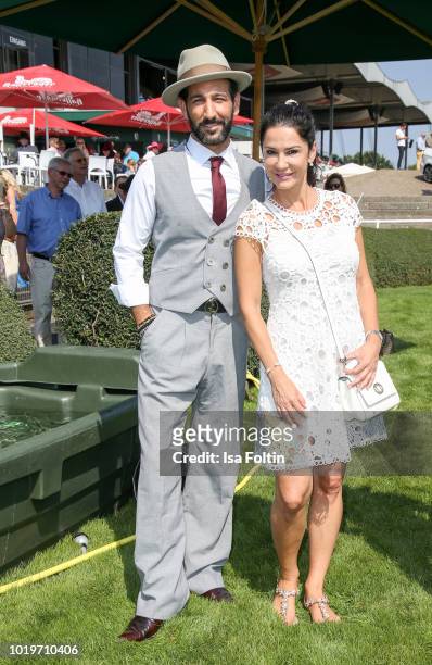 Dancer Massimo Senato and German actress Mariella Ahrens during the Audi Ascot Race Day 2018 on August 19, 2018 in Hanover, Germany.