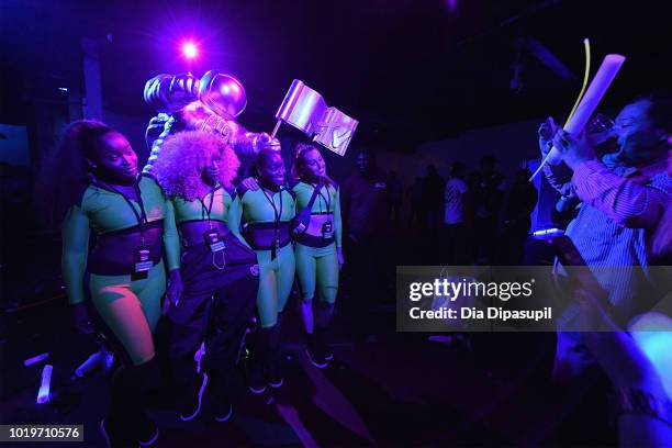 Rita Ora's dancers pose with the MTV Moonperson during the MTV VMA Kickoff Concert presented by DirecTV Now at Terminal 5 on August 19, 2018 in New...