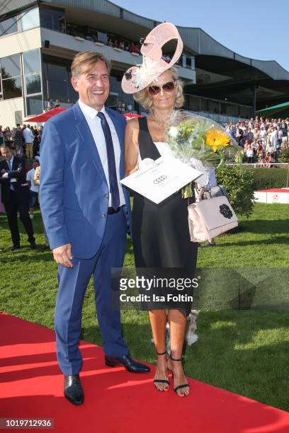 Jan Laubrunn with the winner of the hat competition during the Audi Ascot Race Day 2018 on August 19, 2018 in Hanover, Germany.