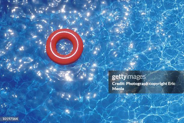 life preserver floating on water, elevated view (digital enhancement) - red tube 個照片及圖片檔