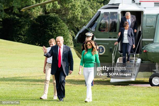 President Donald Trump, First Lady Melania Trump, and Barron Trump as well as Melania Trump's parents Viktor Knavs and Amalija Knavs seen returning...