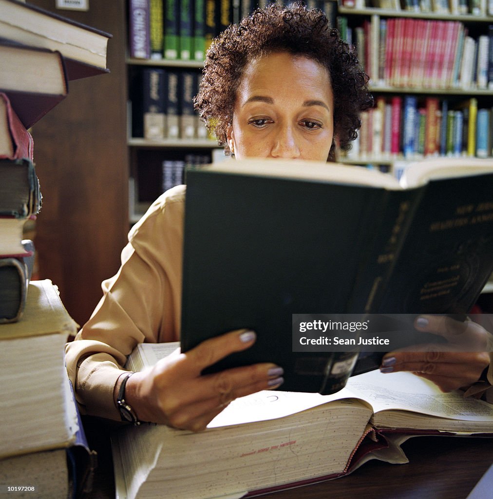 Woman studying in library