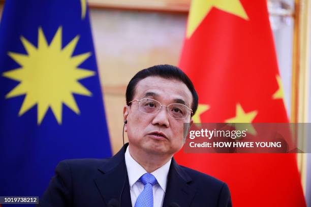 China's Premier Li Keqiang speaks during a joint press conference with Malaysia's Prime Minister Mahathir Mohamad at the Great Hall of the People in...