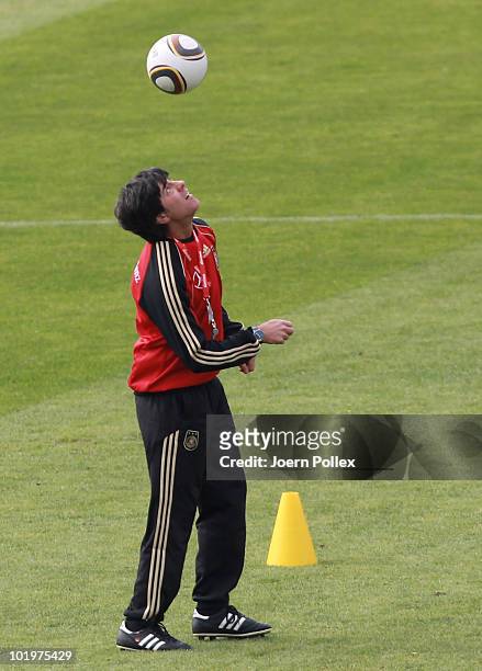 Head coach Joachim Loew of Germany controls the ball during training session at Super stadium on June 11, 2010 in Pretoria, South Africa.