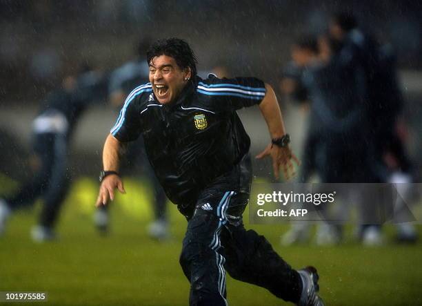 Argentina's national team coach Diego Maradona celebrates after the FIFA World Cup South Africa-2010 qualifier football match against Peru at...