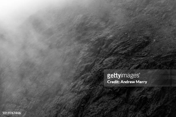 close-up of rock face and cloud, isle of skye - rock background stock pictures, royalty-free photos & images