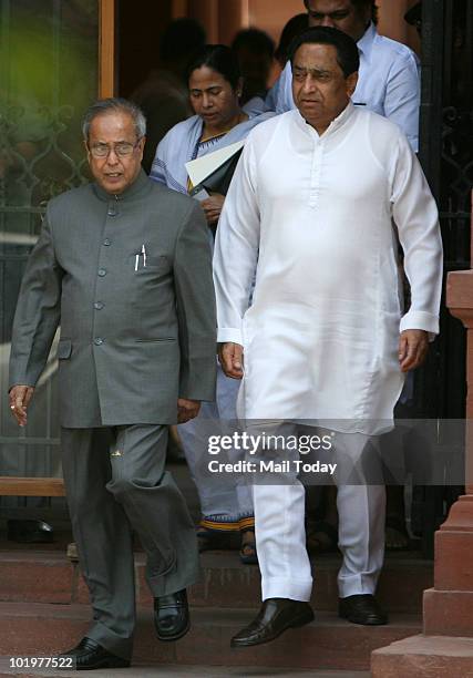 Union Ministers Pranab Mukherjee, Kamal Nath and Mamata Banerjee come out after attending a Cabinet meeting at South Block in New Delhi on June 10,...