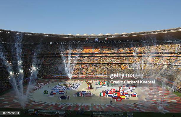 Performers display the flags of all the teams in competition during the Opening Ceremony ahead of the 2010 FIFA World Cup South Africa Group A match...