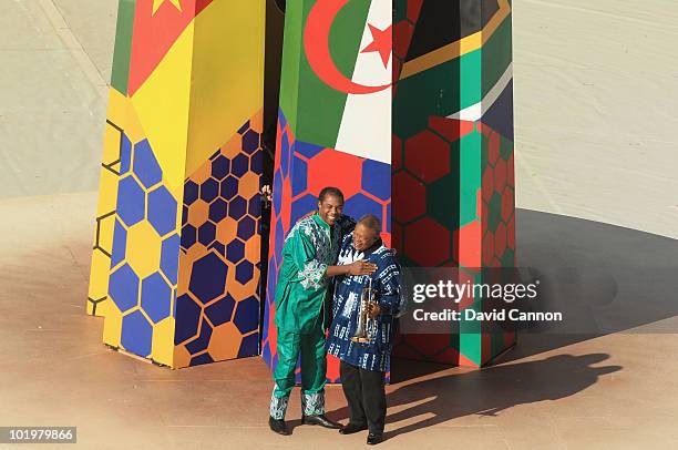 Nigerian singer Femi Kuti and South African trumpeter Hugh Masekela perform during the Opening Ceremony ahead of the 2010 FIFA World Cup South Africa...