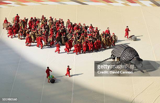 Dancers perform behind a giant beetle during the Opening Ceremony ahead of the 2010 FIFA World Cup South Africa Group A match between South Africa...