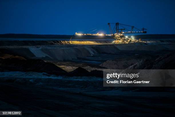 Stacker conveying overburden is pictured at the lignite mine Welzow-Sued during blue hour on August 15, 2018 in Neupetershain, Germany.