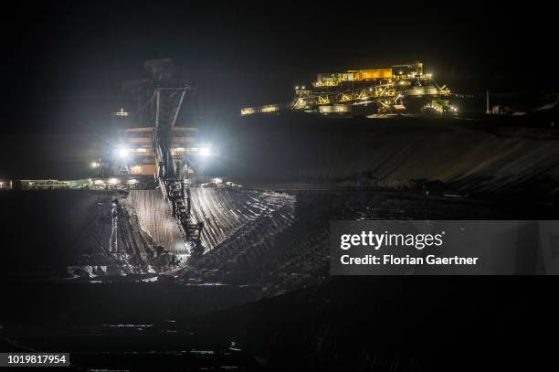 Bucket wheel excavator is pictured at the lignite mine Welzow-Sued at night on August 15, 2018 in Welzow, Germany.