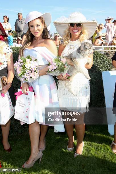 Musical actress Kathy Savannah Krause and Carola Rau with her dog Daisy during the Audi Ascot Race Day 2018 on August 19, 2018 in Hanover, Germany.