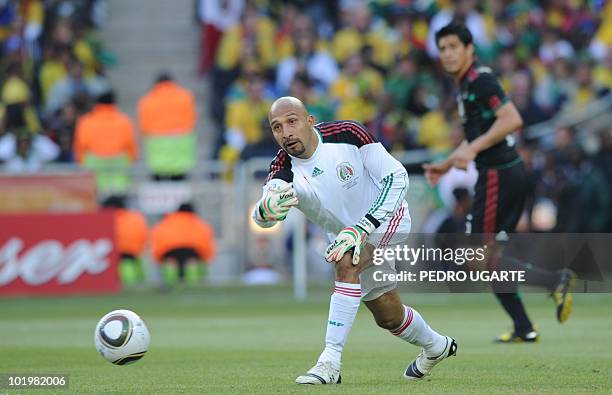 Mexico's goalkeeper Oscar Perez throws the ball during their Group A first round 2010 World Cup football match on June 11, 2010 at Soccer City...