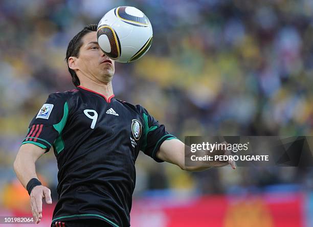 Mexico's striker Guillermo Franco controls the ball during the Group A first round 2010 World Cup football match South Africa vs. Mexico on June 11,...