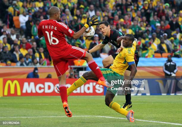 Itumeleng Khune of South Africa makes a save from a shot by Guillermo Franco of Mexico during the 2010 FIFA World Cup South Africa Group A match...