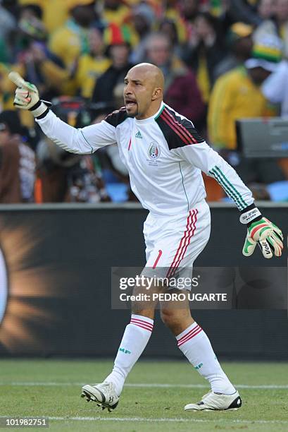 Mexico's goalkeeper Oscar Perez gestures during their Group A first round 2010 World Cup football match on June 11, 2010 at Soccer City stadium in...