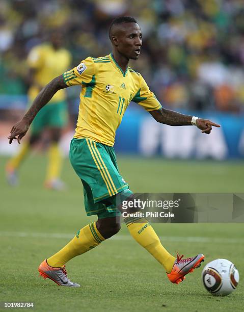 Teko Modise of South Africa runs with the ball during the 2010 FIFA World Cup South Africa Group A match between South Africa and Mexico at Soccer...