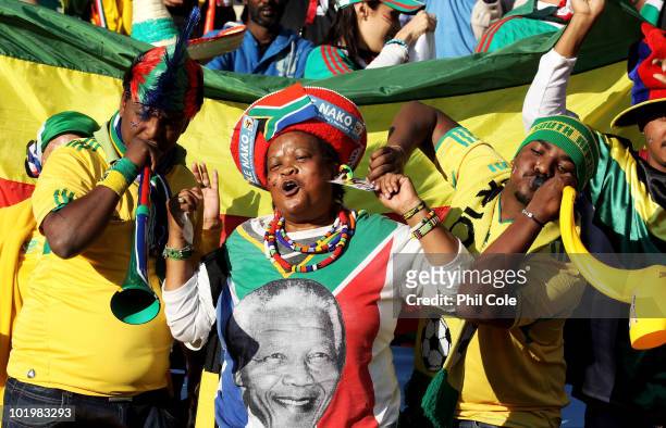 South Africa fans show their support for Nelson Mandela at the Opening Ceremony ahead of the 2010 FIFA World Cup South Africa Group A match between...