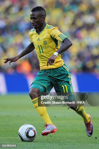 Teko Modise of South Africa runs with the ball during the 2010 FIFA World Cup South Africa Group A match between South Africa and Mexico at Soccer...