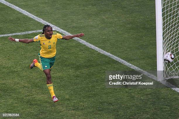 Siphiwe Tshabalala of South Africa celebrates scoring the first goal during the 2010 FIFA World Cup South Africa Group A match between South Africa...