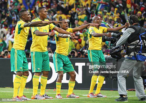 Siphiwe Tshabalala of South Africa celebrates scoring the first goal with team mates during the 2010 FIFA World Cup South Africa Group A match...