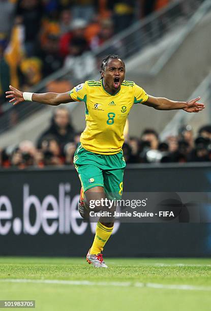 Siphiwe Tshabalala of South Africa celebrates scoring the first goal during the 2010 FIFA World Cup South Africa Group A match between South Africa...