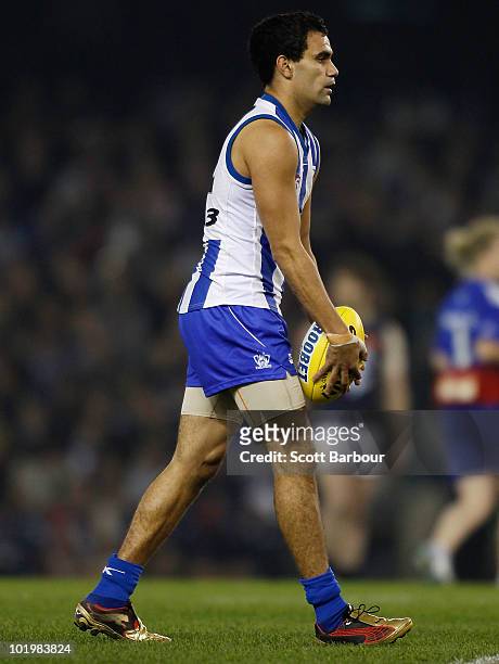 Lindsay Thomas of the Kangaroos prepares to kick the ball during the round 12 AFL match between the North Melbourne Kangaroos and the Carlton Blues...