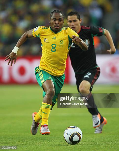 Siphiwe Tshabalala of South Africa runs with the ball during the 2010 FIFA World Cup South Africa Group A match between South Africa and Mexico at...