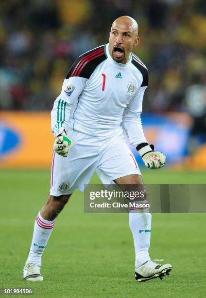 Oscar Perez of Mexico celebrates after Rafael Marquez of Mexico scored the second goal to equalise during the 2010 FIFA World Cup South Africa Group...