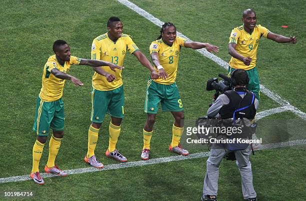 Siphiwe Tshabalala of South Africa celebrates scoring the first goal with team mates during the 2010 FIFA World Cup South Africa Group A match...