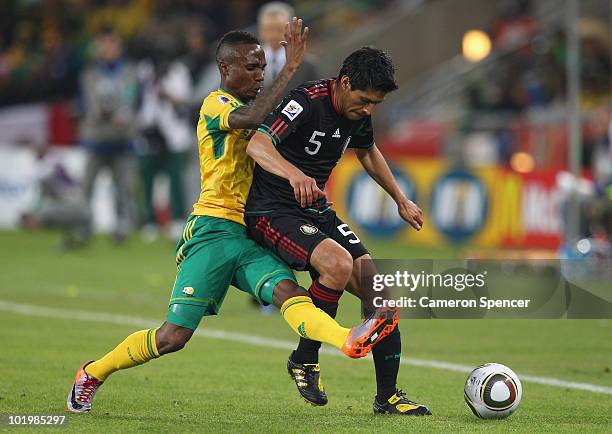 Ricardo Osorio of Mexico holds off a challenge during the 2010 FIFA World Cup South Africa Group A match between South Africa and Mexico at Soccer...