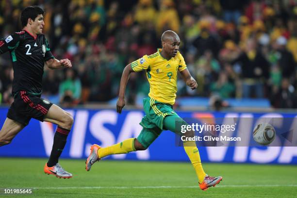 Katlego Mphela of South Africa is closed down by Francisco Rodriguez of Mexico during the 2010 FIFA World Cup South Africa Group A match between...