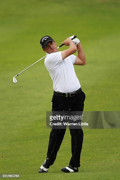 Francois Delamontagne of France plays his second shot into the 16th green during the second round of the Estoril Open de Portugal at Penha Longa...