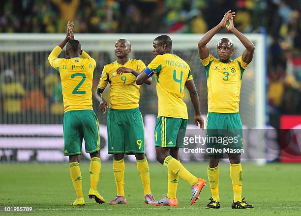 Siboniso Gaxa, Katlego Mphela, Aaron Mokoena and Tsepo Masilela of South Africa applaud the fans after a draw in the 2010 FIFA World Cup South Africa...