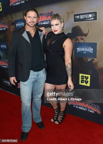 Wrestler John Hennigan and Taya Valkyrie arrives for the Premiere Of The Asylum And Syfy's "The Last Sharknado: It's About Time" held at Cinemark...