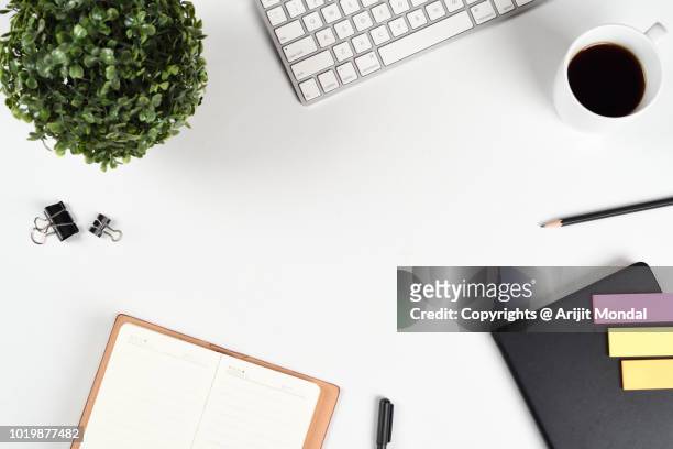 office desk from above with lot of office things computer keyboard, black coffee mug flat lay copy space - business flat lay stock pictures, royalty-free photos & images