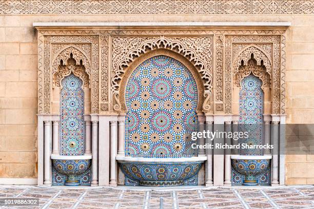 tiled fountain on mosque hassan in rabat, morocco - rabat marokko stockfoto's en -beelden