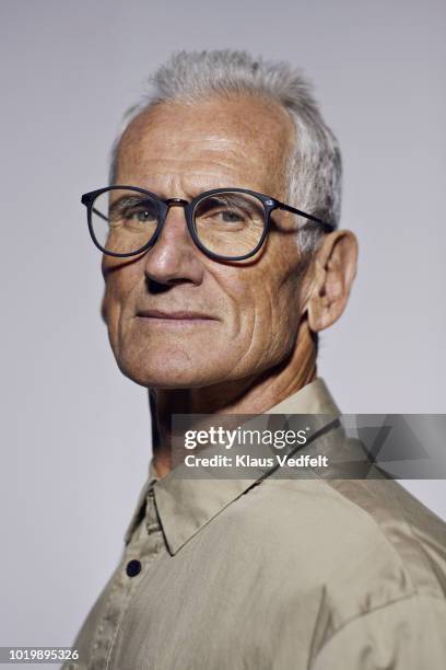 portrait of cool mature man looking in camera - glamour fotografías e imágenes de stock