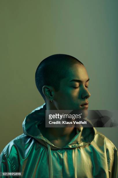 Profile shot of beautiful young man with closed, shot on studio