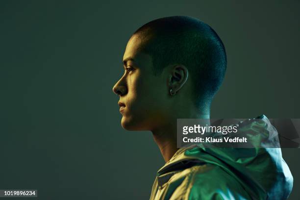 profile shot of beautiful young man, shot on studio - hood clothing stock pictures, royalty-free photos & images
