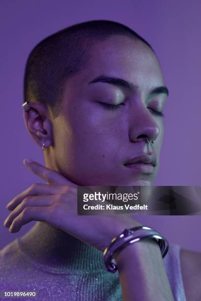 Profile shot of beautiful young man with closed eyes, shot on studio