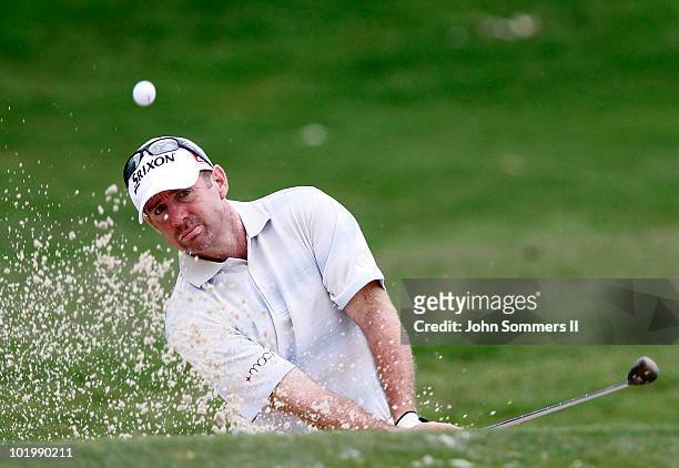 Rod Pampling of Australia chips out of the sand on the first green during the second round of the St. Jude Classic at TPC Southwind held on June 11,...