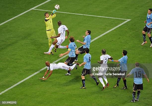 Goalkeeper Fernando Muslera of Uruguay punches the ball away during the 2010 FIFA World Cup South Africa Group A match between Uruguay and France at...